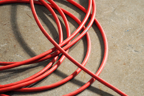 Red color electric power wire cable.